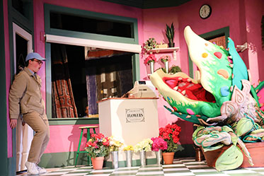 A student acting out a part in "Little Shop of Horrors." Links to Gifts of Cash, Checks, and Credit Cards