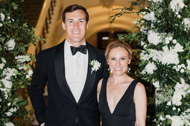 A man and woman smiling together