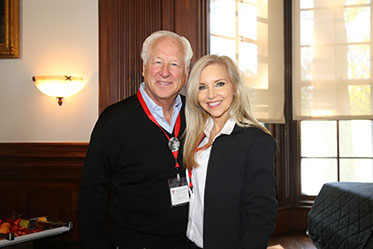 A man and woman smiling together.