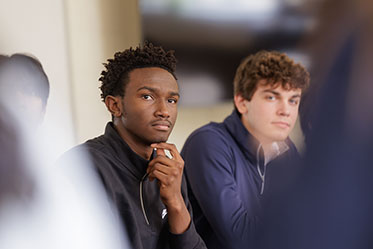 Students paying attention in class. Links to Closely Held Business Stock